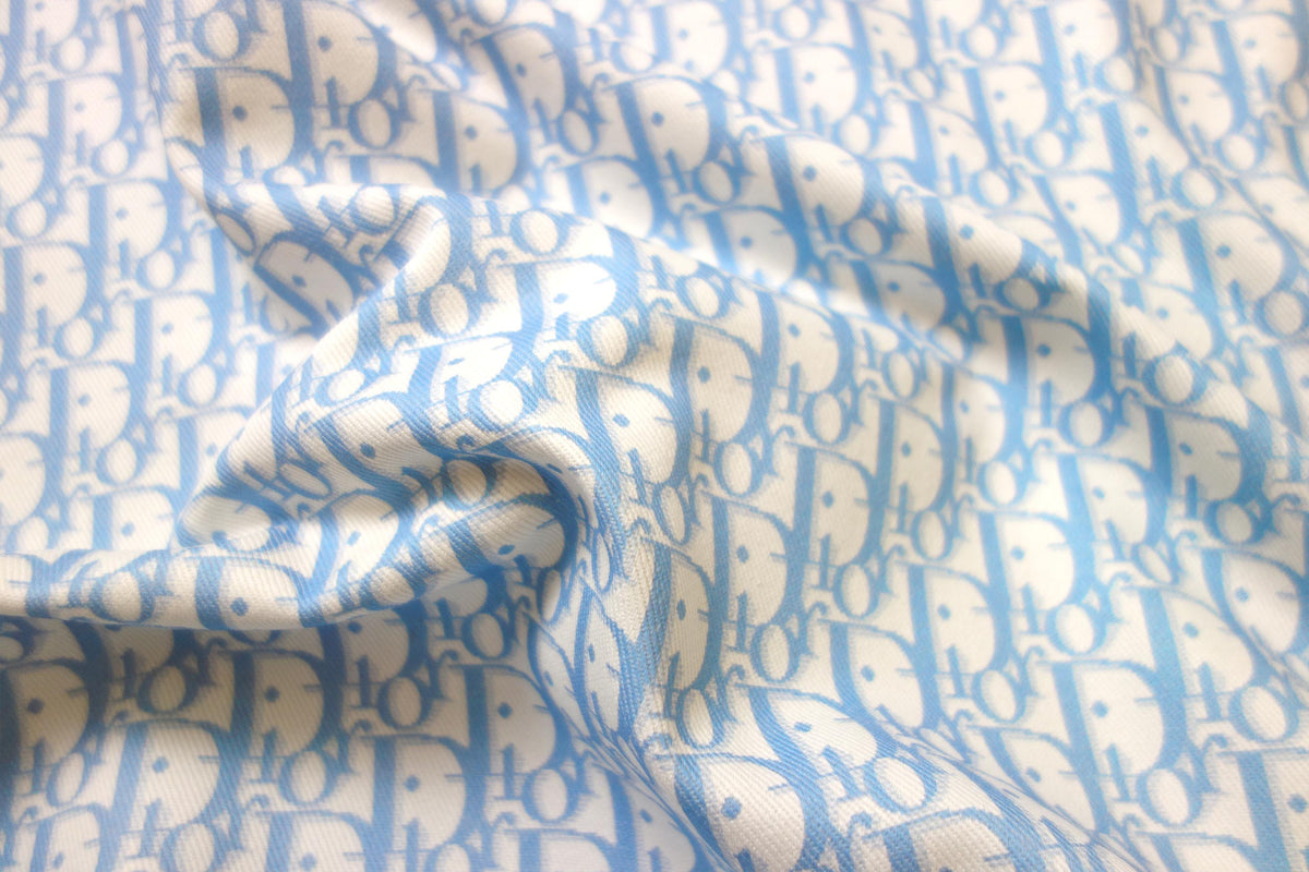 Blue CD monogram print on cotton fabric – logofabrics