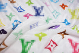 Cozy plush fabric with a multicolor monogram print