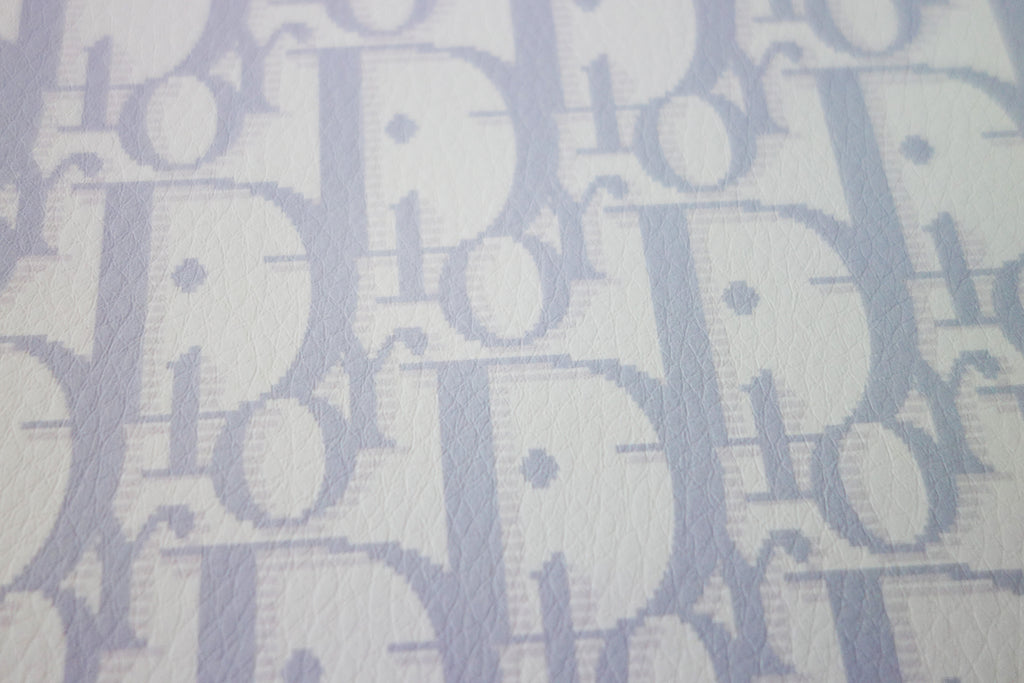 White synthetic leather with baby blue CD monogram print – logofabrics